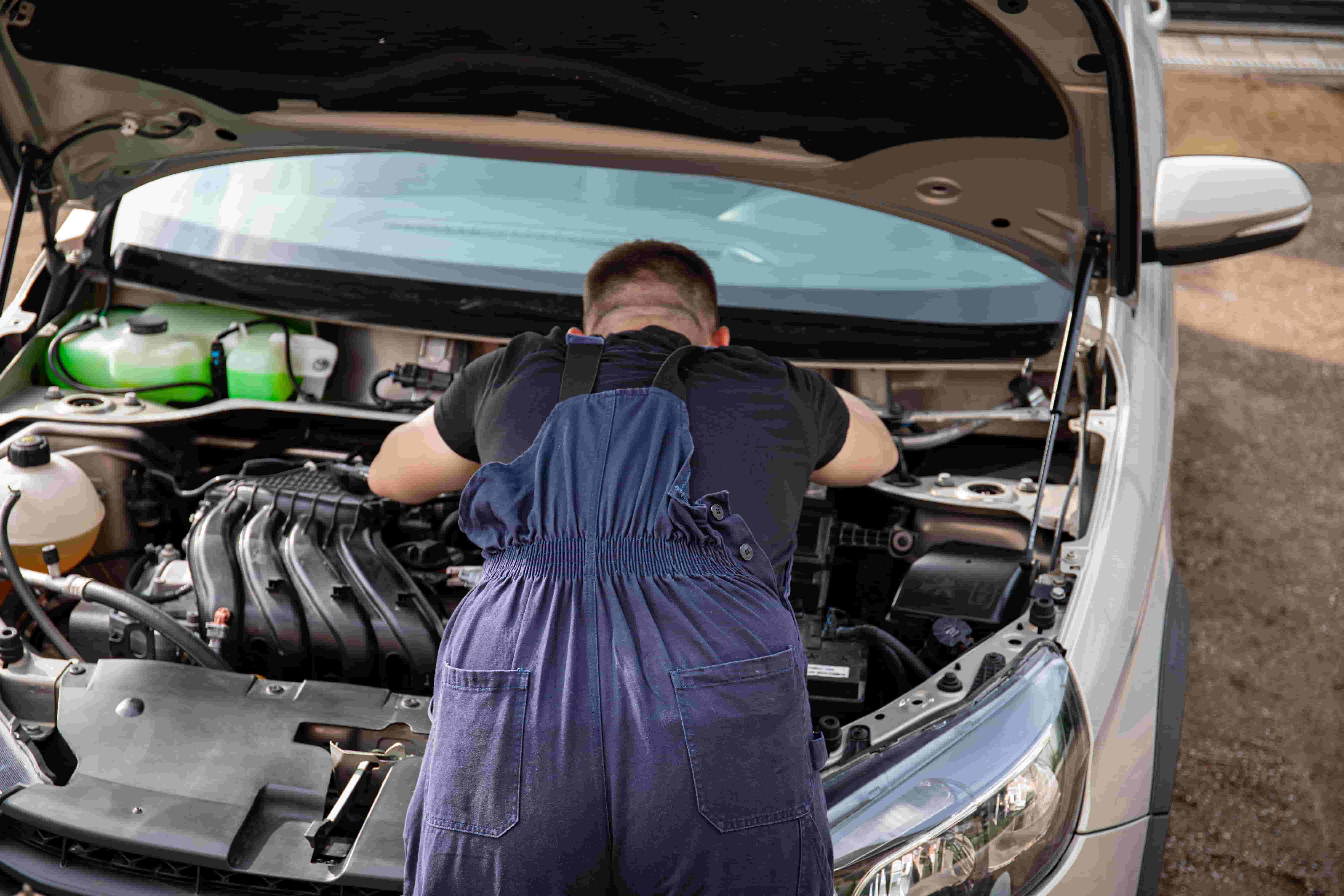 Used car inspection with the hood open before a private sale in Hinesville